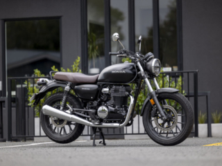 Great photo of a Honda GB350 parked outside a cafe