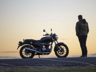 Honda GB350 parked at sunset with rider wearing Ixon jacket and casual motorcycle clothing