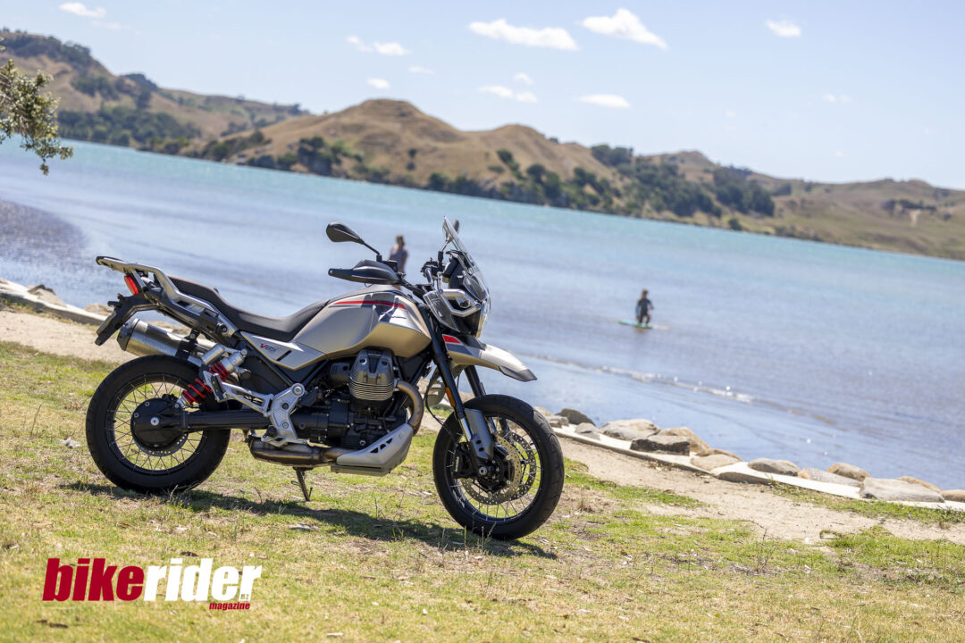 Moto Guzzi V85 TT Travel parked next to lake
