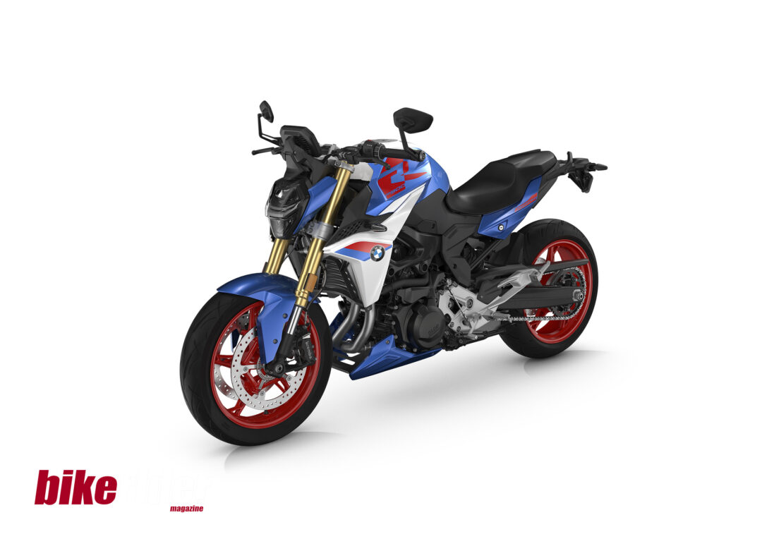 2025 BMW F900R naked roadster in Sport paint scheme with red wheels and bold graphics.