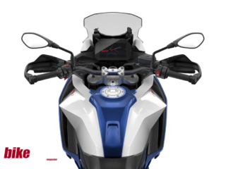 Close-up of BMW F900XR TFT display showing navigation wheel and riding modes.