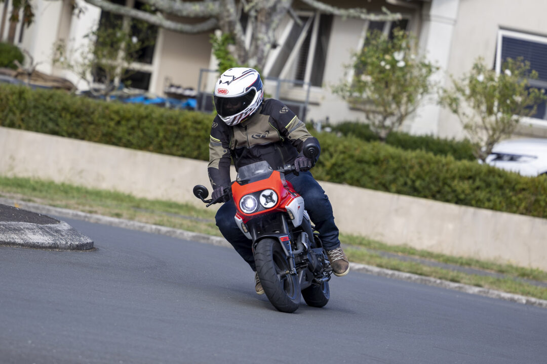 CFMoto XO Papio review cornering action shot around roundabout
