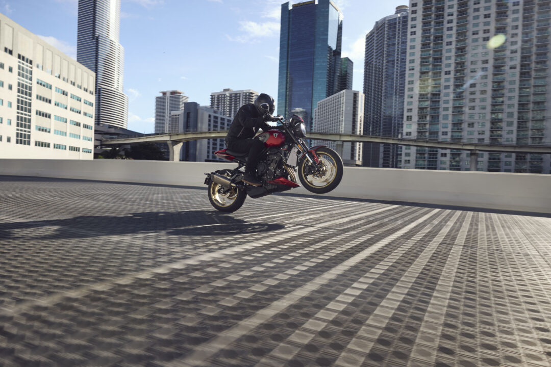 2026 Triumph Trident 800 wheelie on city street