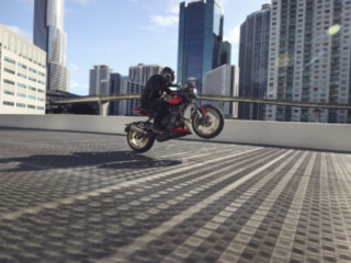 2026 Triumph Trident 800 wheelie on city street