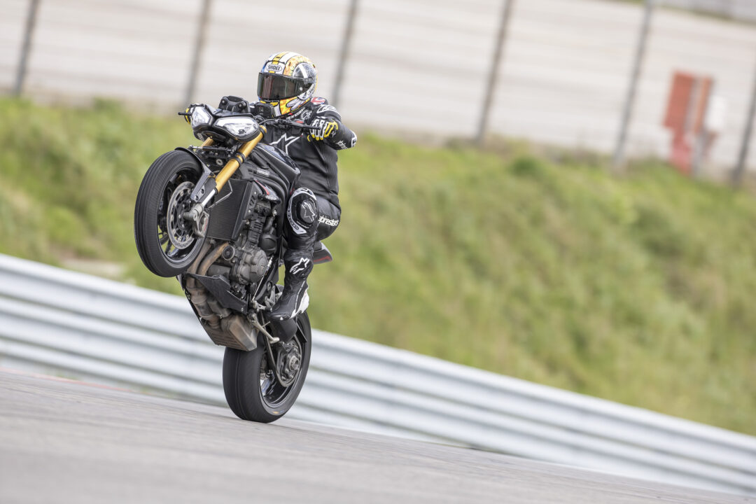 Triumph Speed Triple 120RS action track wet wheelie