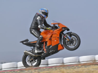 KTM 990 RC R on track at Seville Circuit, wheel stand while standing up on the pegs
