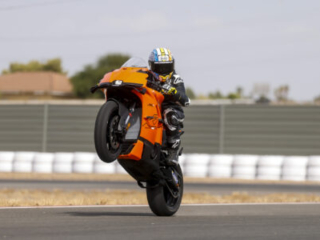 KTM 990 RC R on track at Seville Circuit,wheelie looking at the camera, wheel stand