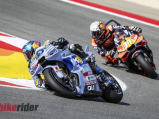 MotoGP Rd21 Autodromo International Algarve Alex Marquez action followed by a KTM