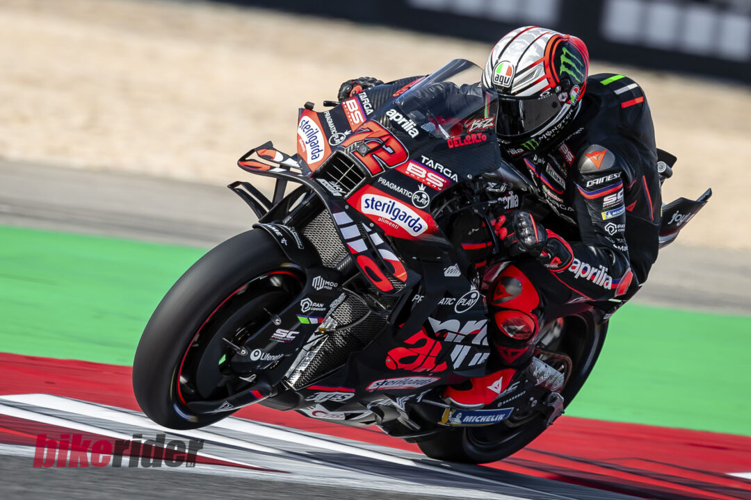 MotoGP Rd21 Autodromo International Algarve Sun Moto GP Race-Marco Bezzecchi wheelie Aprilia MotoGP bike action track