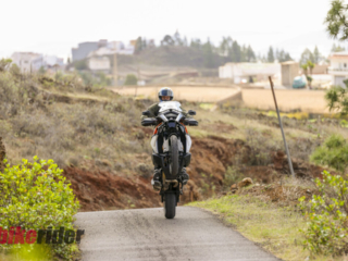 KTM 1390 Super Adventure EVO S review action on the road cornering wheelie without clutch
