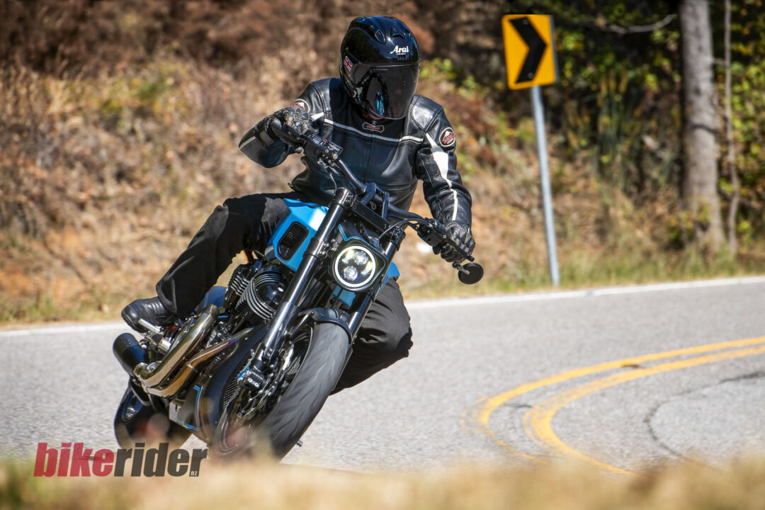 Alan Cathcart with Audette Velos V2 riding on the road