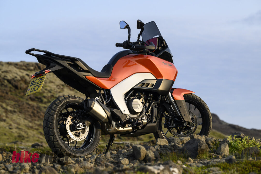 20260704-Norton_Atlas_2026_Offroad_Statics9-1080x720 Orange Norton adventure motorcycle photographed on a rocky trail with a clear blue sky behind it