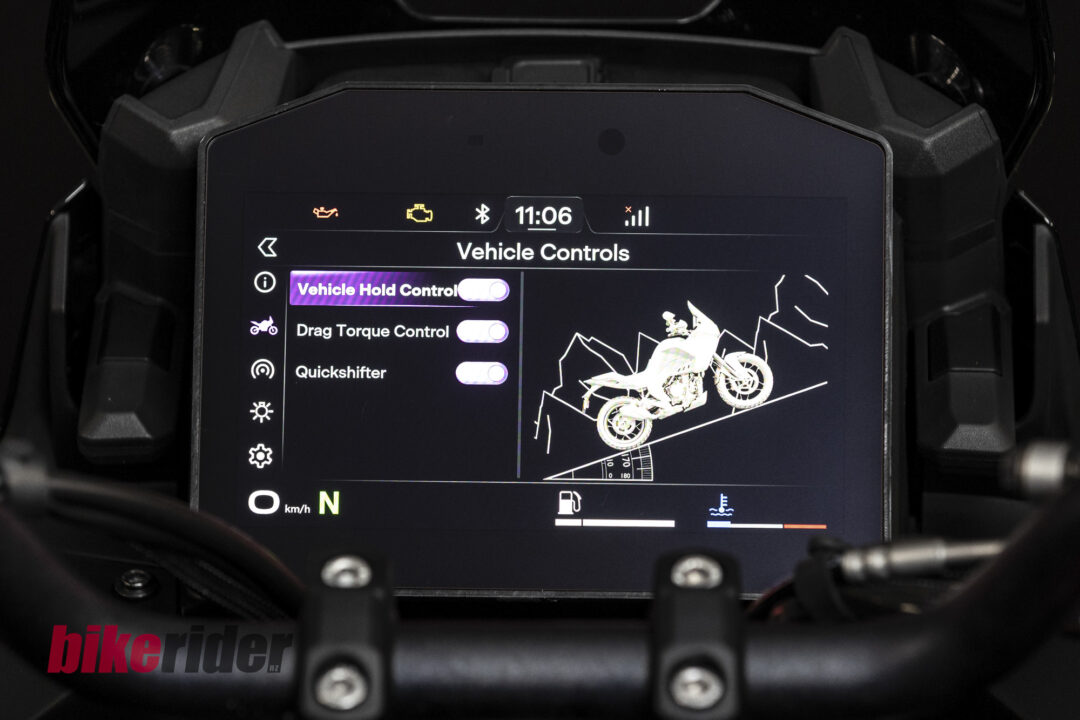 20260706-Norton_Atlas_2026_Clocks8-1080x720 Close-up of a motorcycle digital dashboard showing Vehicle Controls menu with toggles for Vehicle Hold, Drag Torque, and Quickshifter