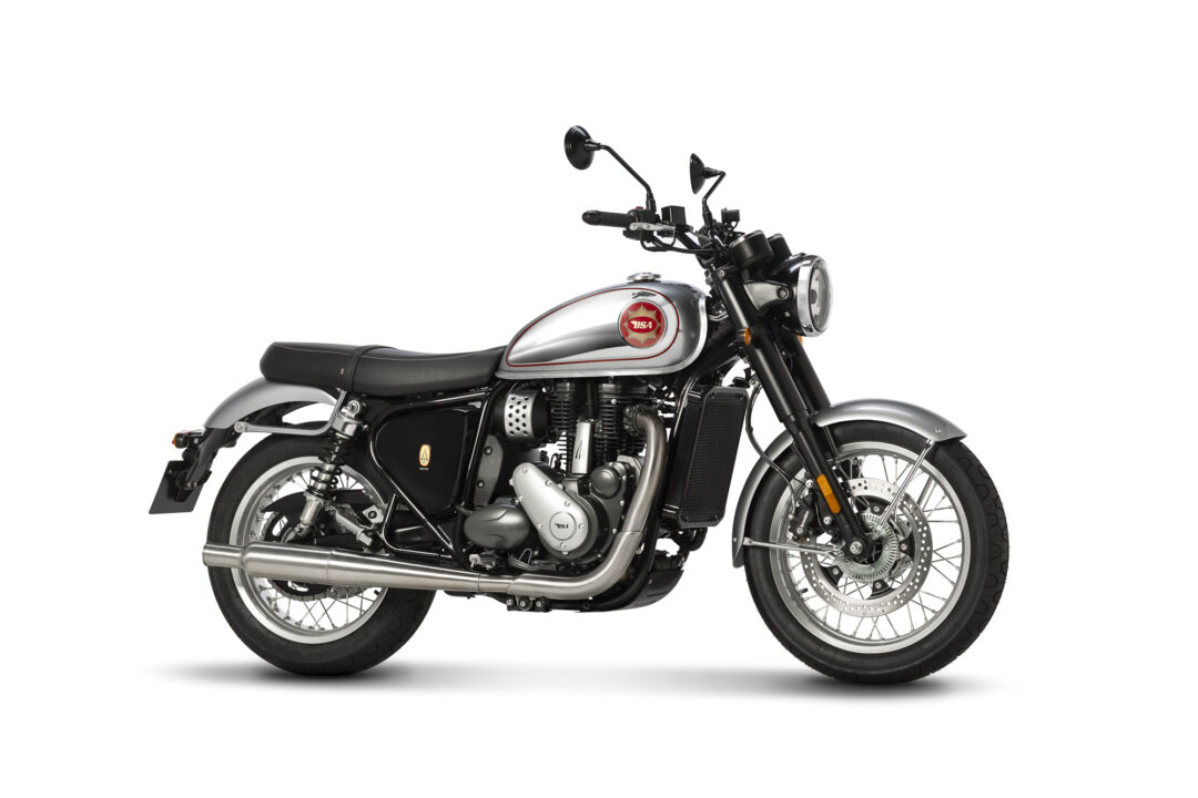 Side view of a silver and black classic motorcycle with a red BSA emblem on the fuel tank, set against a white background.