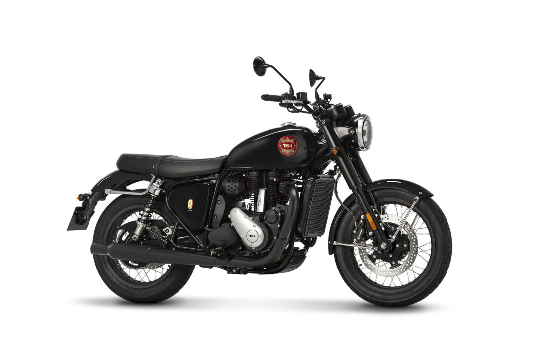 Black motorcycle shown from the left-side profile, with chrome accents and a red circular badge on the fuel tank against a white background.