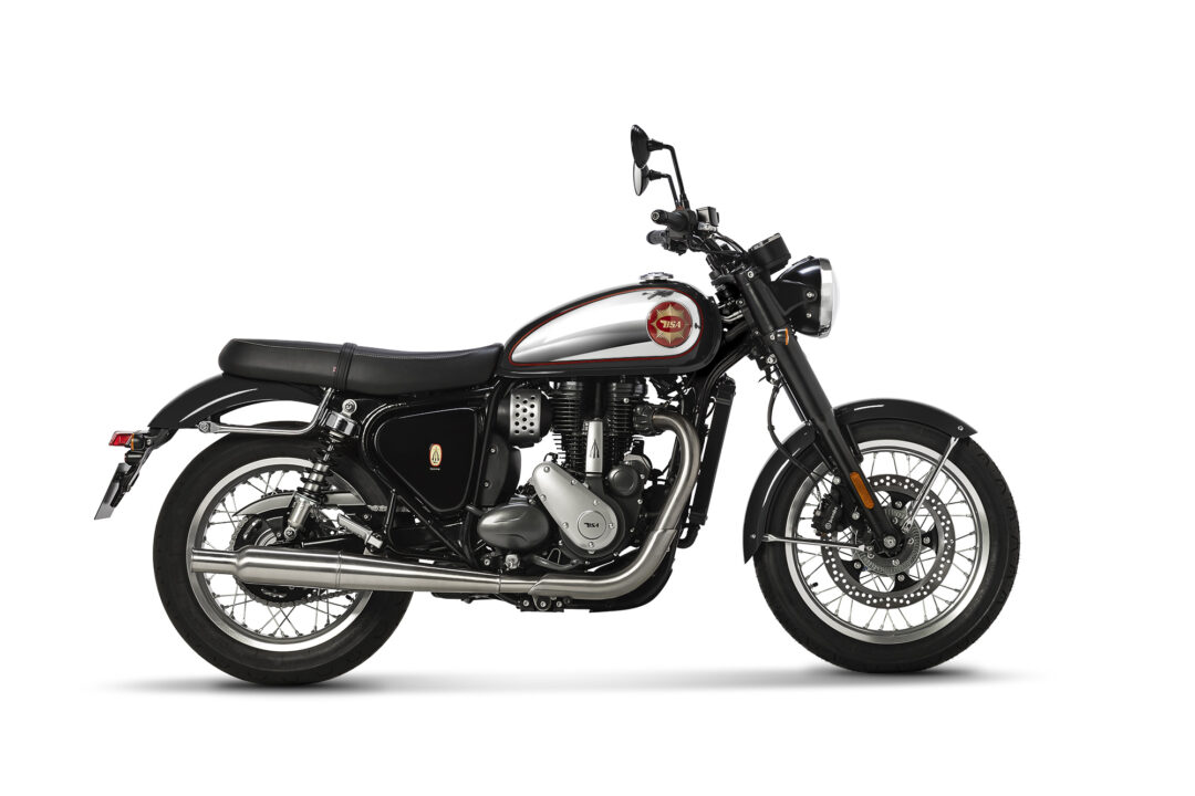 Side view of a black chrome retro motorcycle with a white fuel tank and red emblem on a white background, showing handlebars and headlamp in profile.
