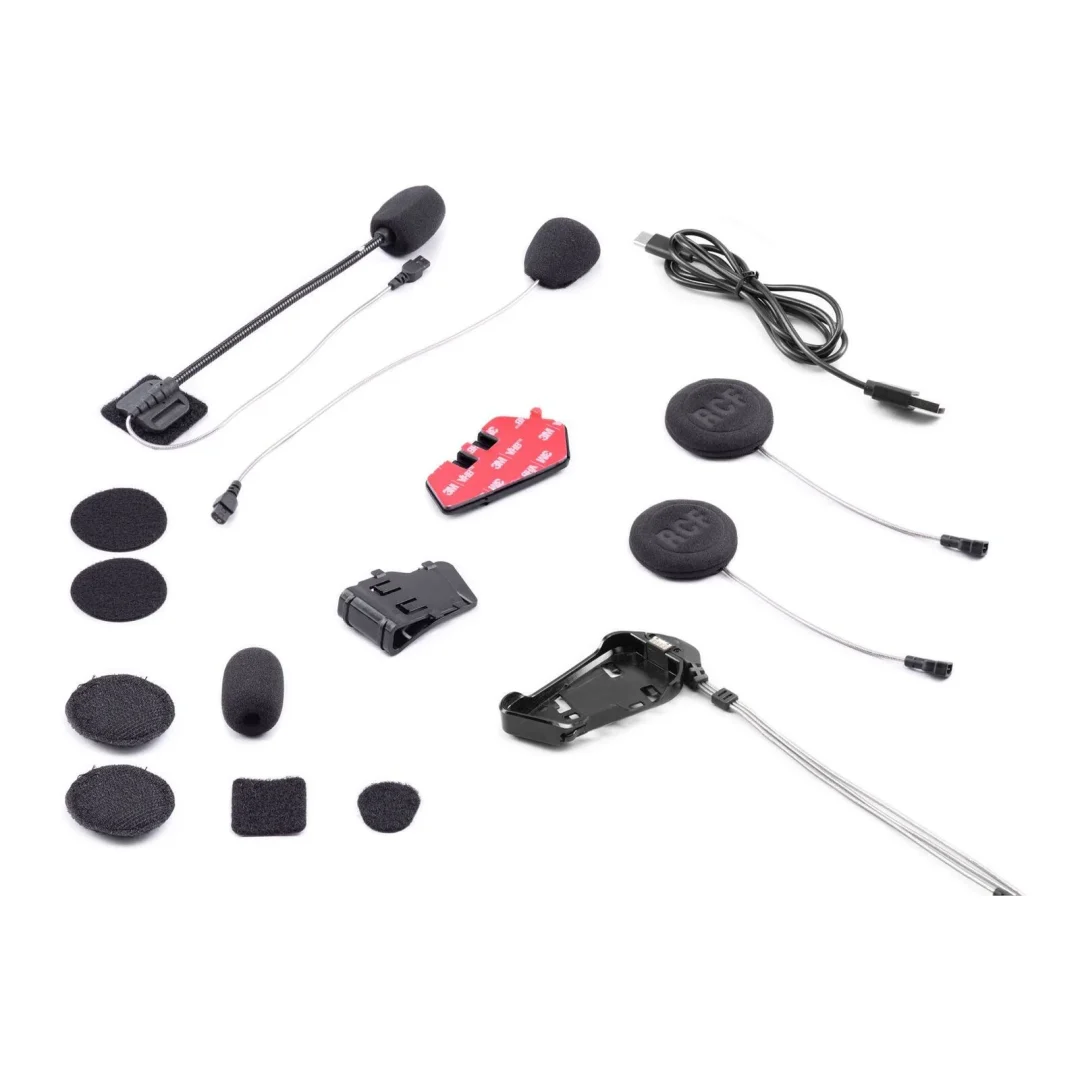 Assorted headset microphone kit pieces on a white background: foam windscreen mics, small lapel mics, adhesive pads, and mounting clips/holders with cables.