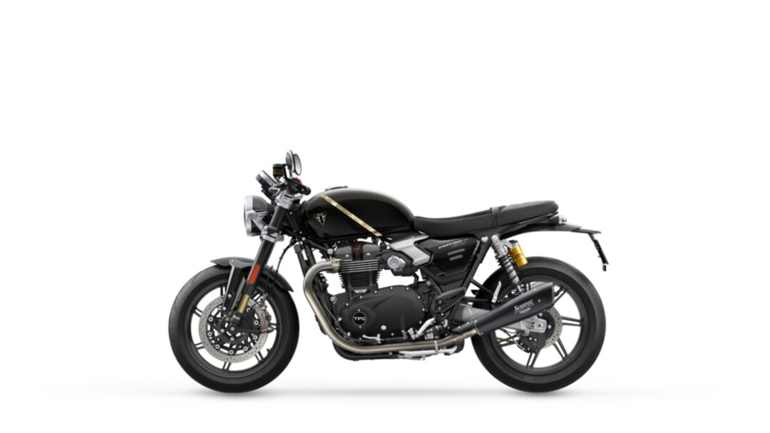 Black motorcycle shown in profile with a gold stripe along the tank on a white background (studio shot)