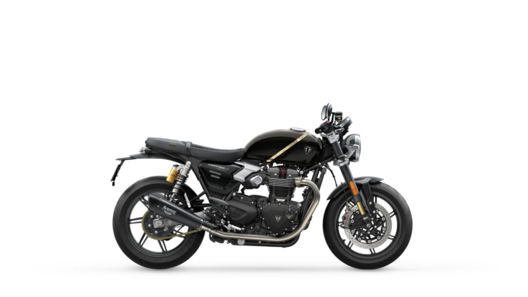 Black cafe-r racer–style motorcycle shown in a left-side profile, featuring a black fuel tank with a gold stripe, exposed engine, and chrome exhausts on a white background?