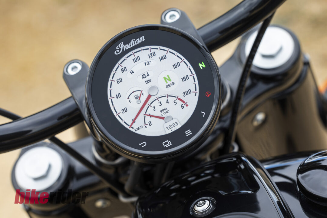 Close-up of Indian motorcycle instrument cluster showing speedometer, RPM gauge, and a green 'N' gear indicator in neutral.