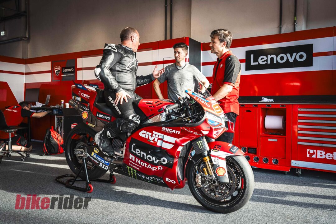 Adam on Marquez Ducati MotoGP bike talking to Casey Stoner