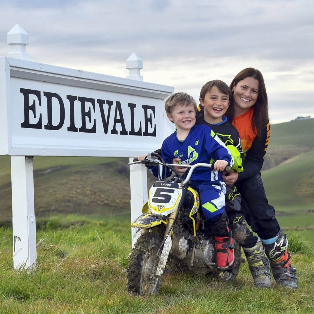 Kylie Dorr NZ ISDE Manager with children on Suzuki dirt bike