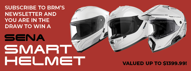 Red banner ad promoting BRM's newsletter with a chance to win a Sena Smart Helmet; three white helmets pictured and text reading 'Subscribe to BRM's newsletter and you are in the draw to win a Sena Smart Helmet' and 'Valued up to $1399.99'