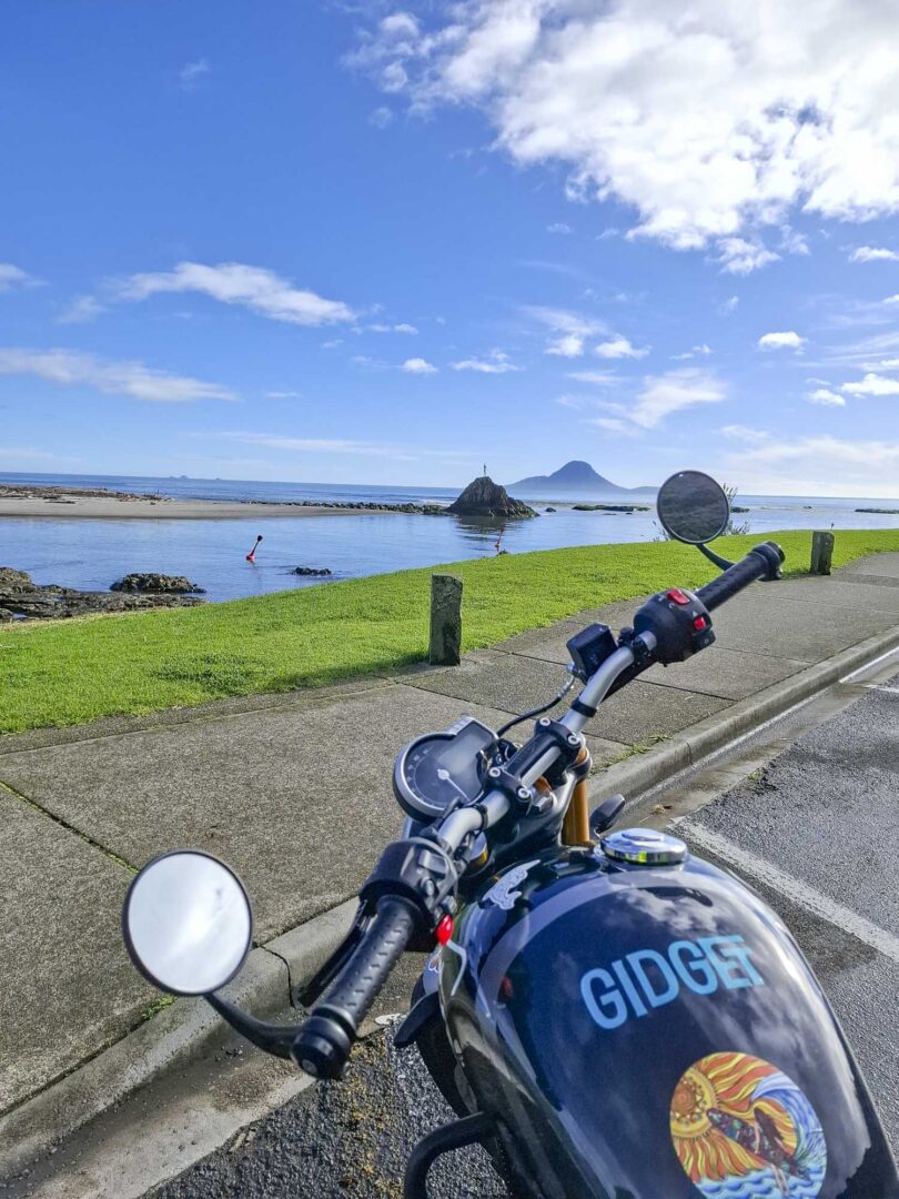 Triumph 400X NZ parked by mermaid in whakatane