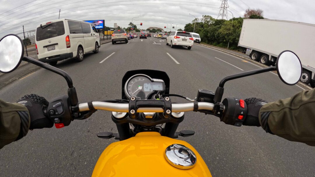 Riding a Triumph Scrambler in traffic in Auckland New Zealand