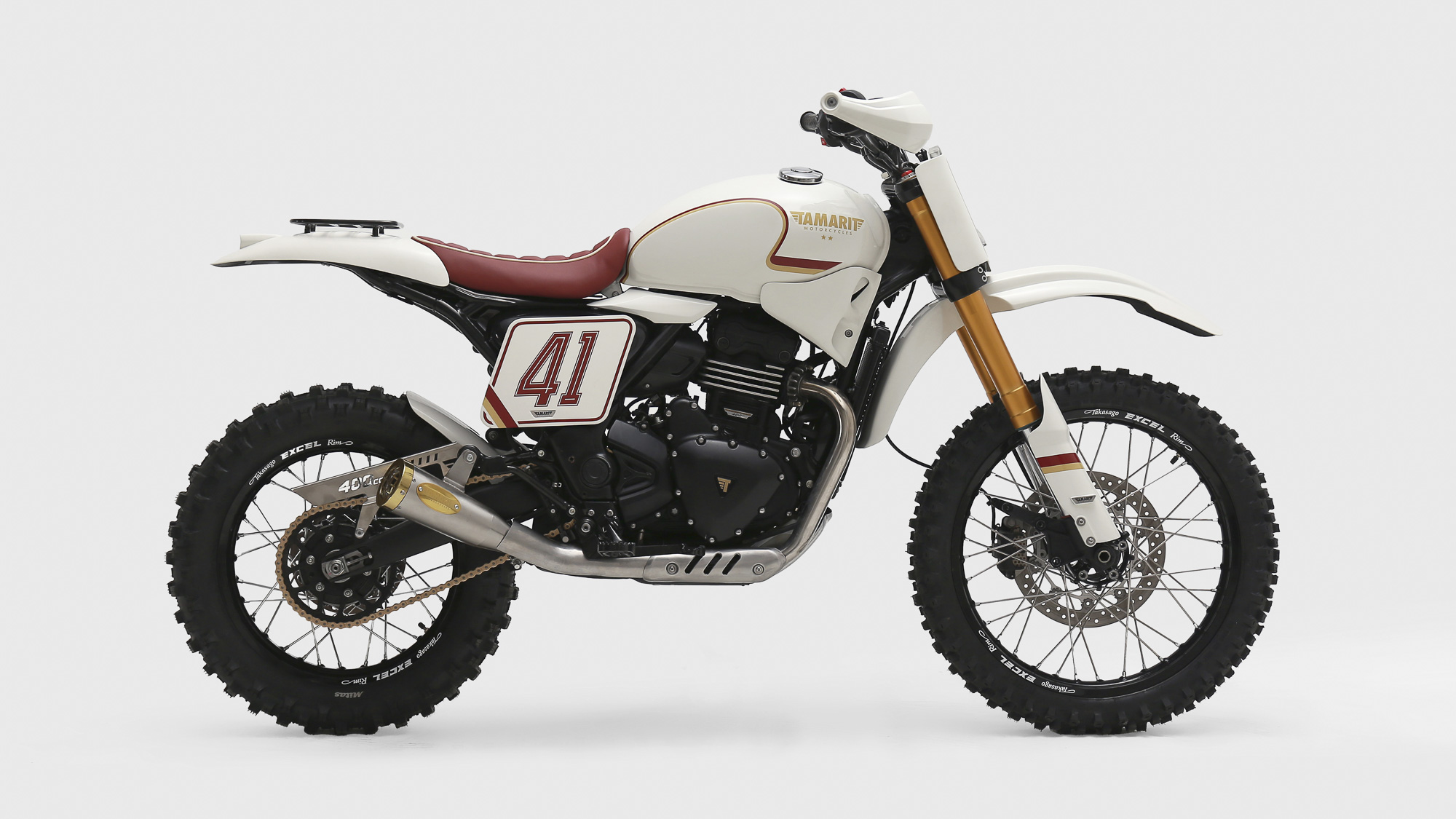 Right side of Tamarit’s white and red number 41 Triumph Scrambler 400 XC