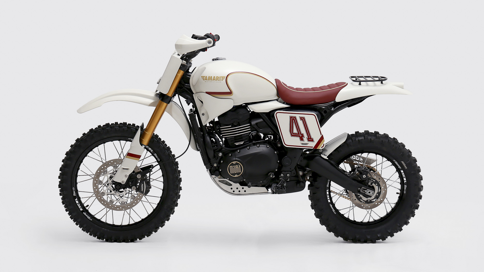Left-side profile of Tamarit’s white and red Scrambler 400 XC