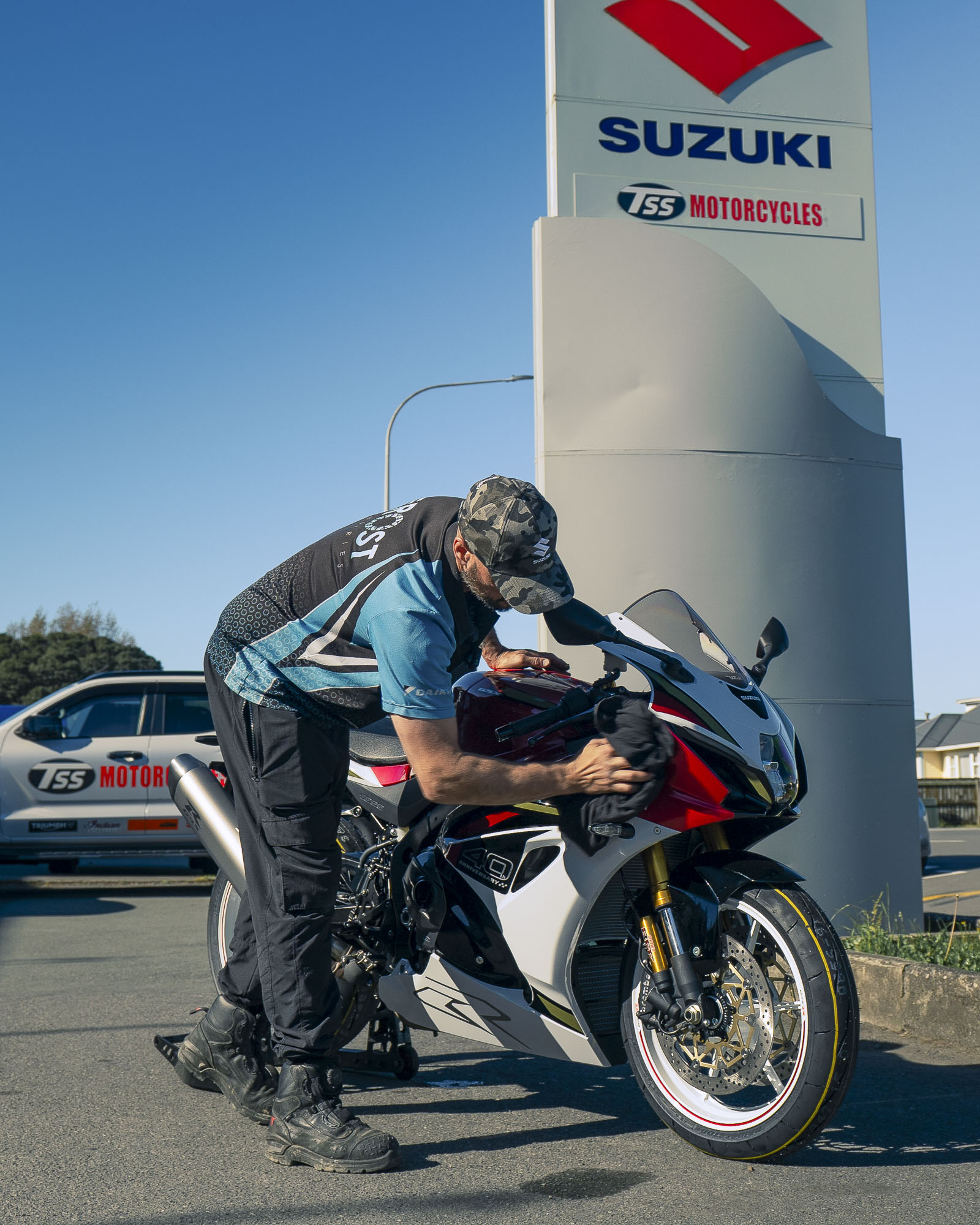 The red Suzuki GSX-R1000R being polished outside TSS Motorcycles