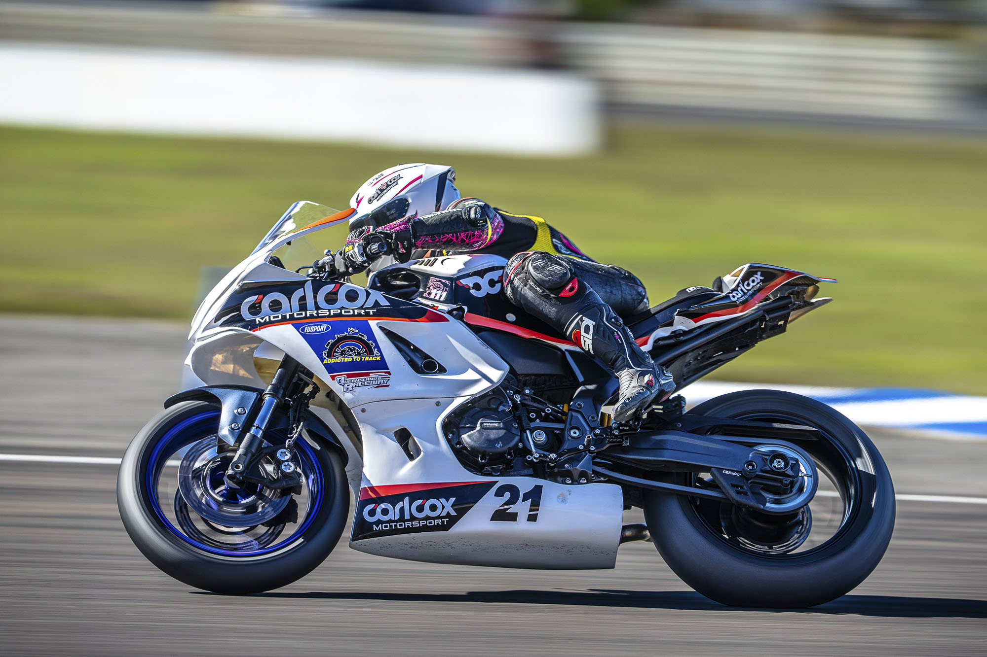 Avalon Lewis leaning her Carl Cox Motorsport Yamaha into a corner