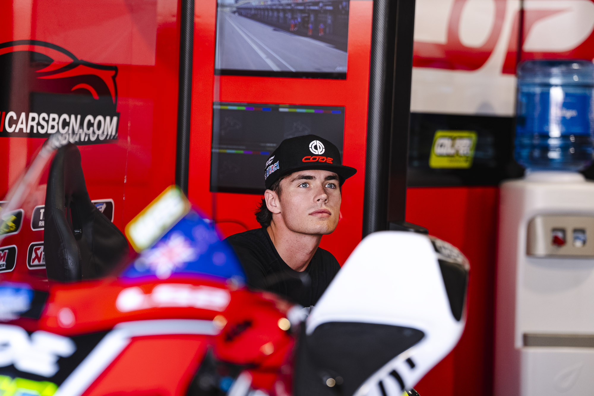 Cormac Buchanan sitting in the CODE Motorsport garage.