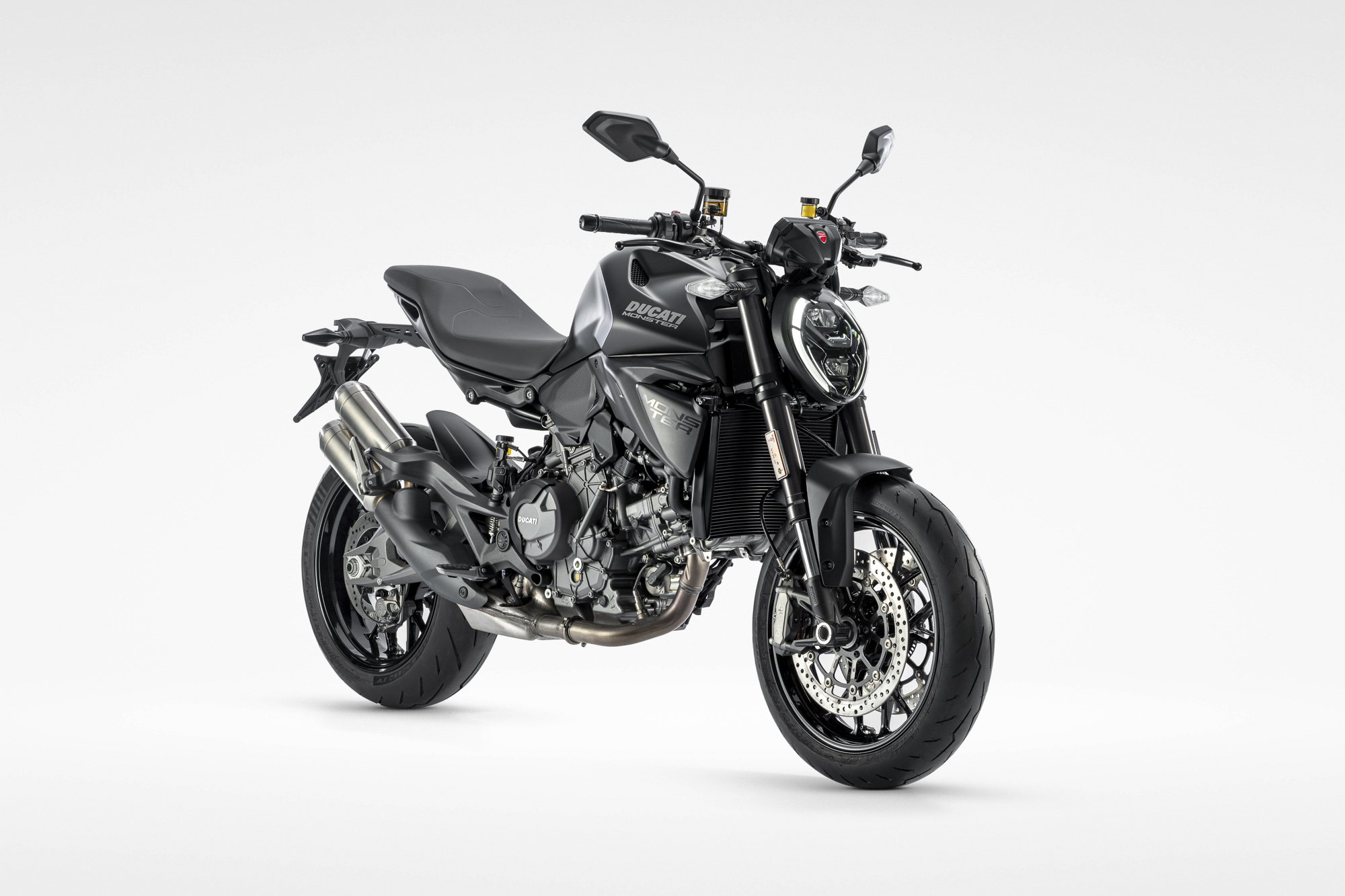 Ducati Monster Dark black naked motorcycle front three-quarter view
