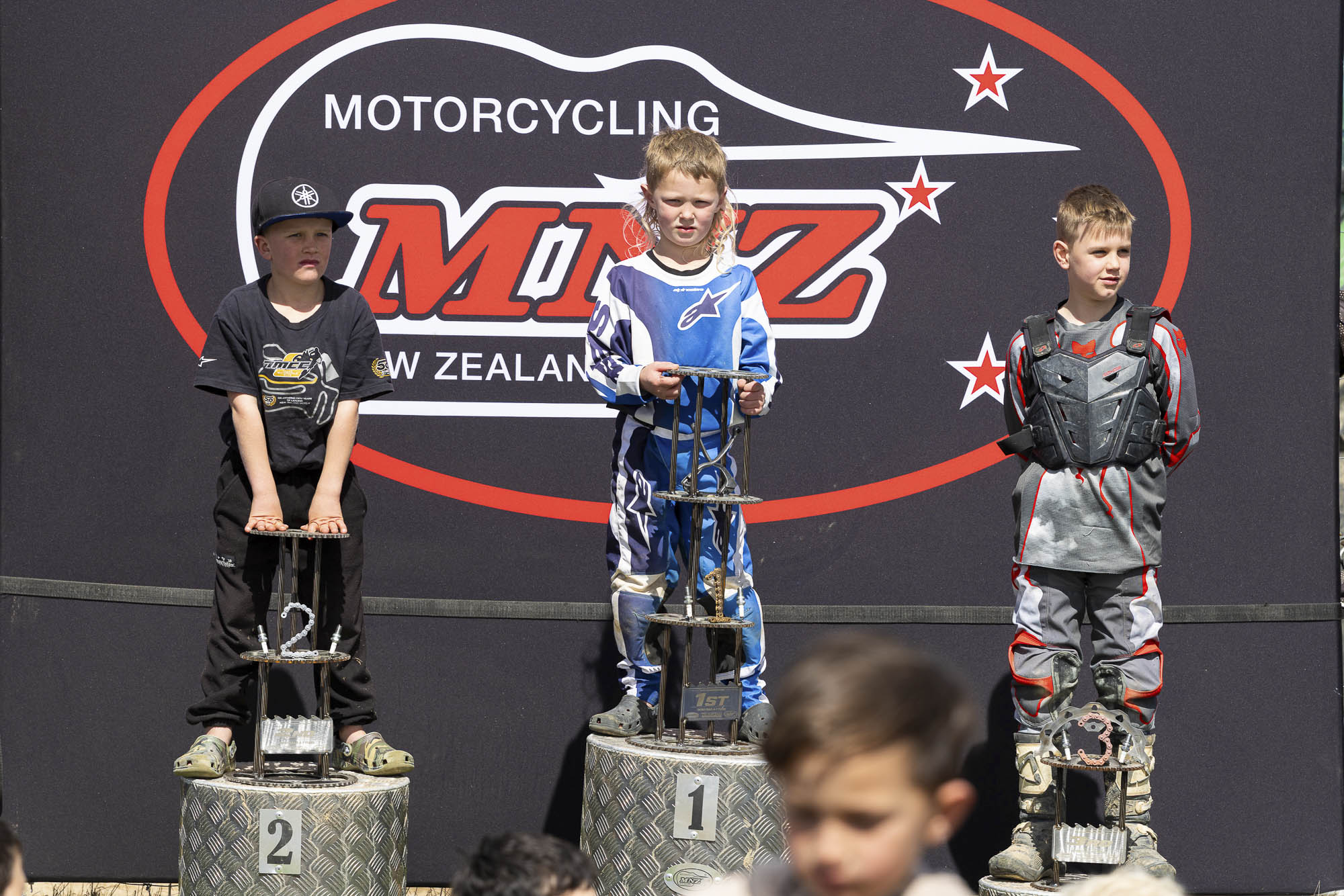 20261004-20261004_MiniMX_3396 The Intro Trail 50 class podium (from left): Cooper Whyte (2nd), Oakley McGechan (1st) and Jack Annals at the 2026 NZ Mini Motocross Nationals