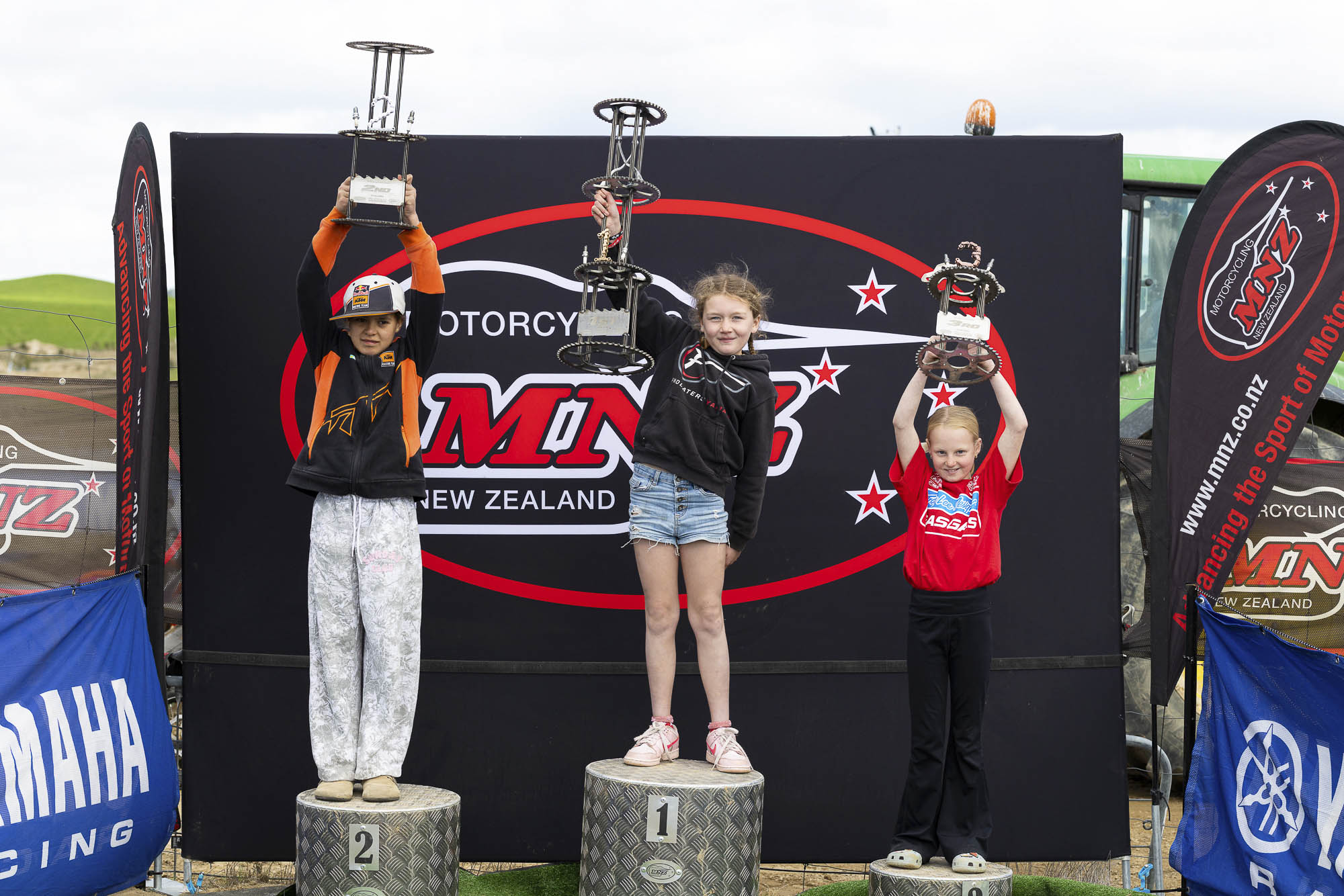 The inaugural Mini Girls class podium (from left): Unique Niania (2nd), Mia Manston (1st) and Libby Wind at the 2026 NZ Mini Motocross Nationals