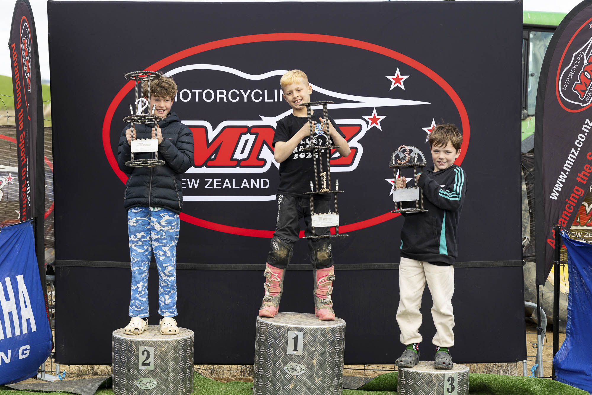 20261004-20261004_MiniMX_3478 The Trail 7-9 Years class podium (from left): Jett Schmidt (2nd), Karter Tupaea (1st) and Charlie Dowman at the 2026 NZ Mini Motocross Nationals