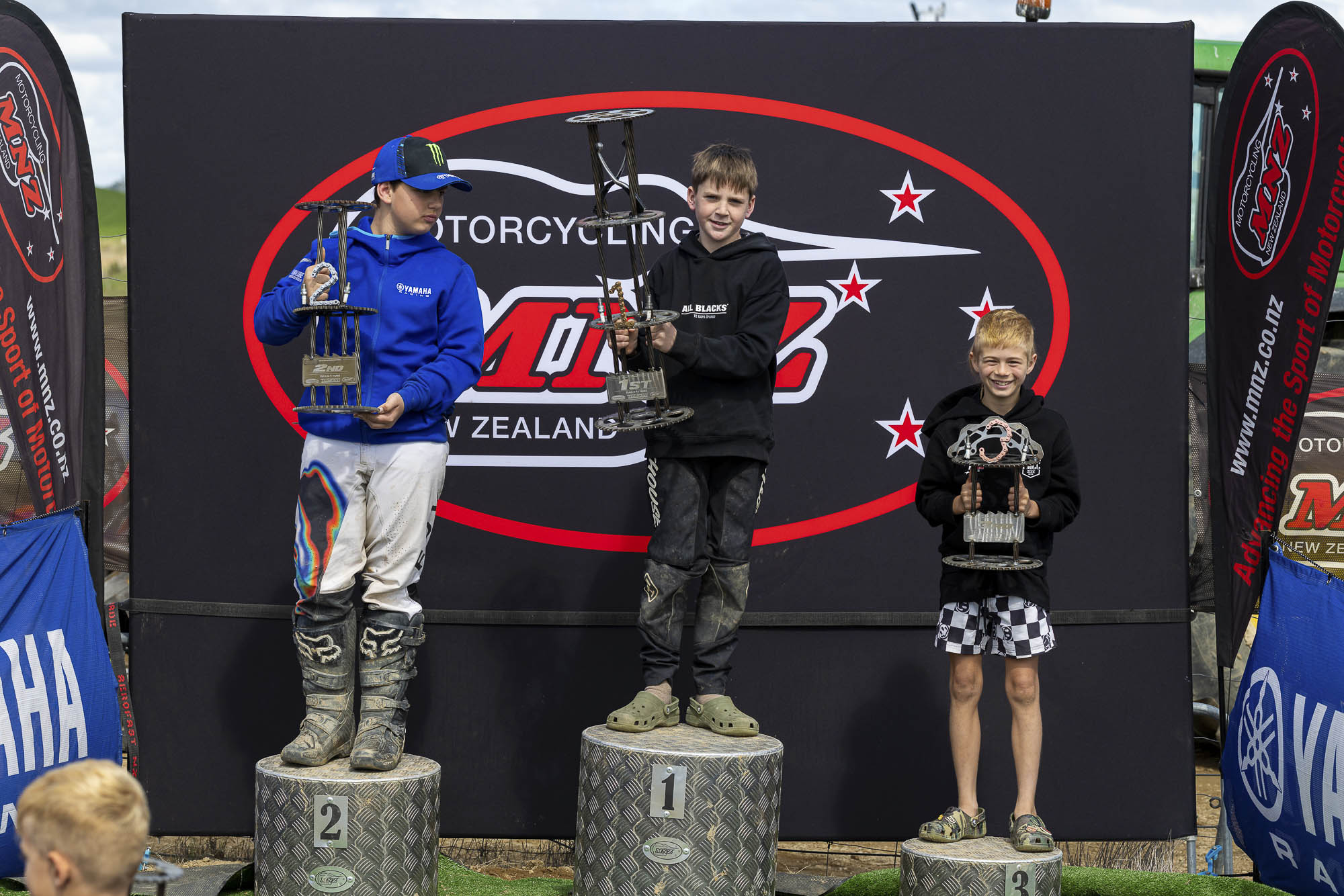 20261004-20261004_MiniMX_3495 The Trail 8-11 Years class podium (from left): Brax Lee (2nd), Jack Bunn (1st) and Kieran Dobbs (3rd) at the 2026 NZ Mini Motocross Nationals