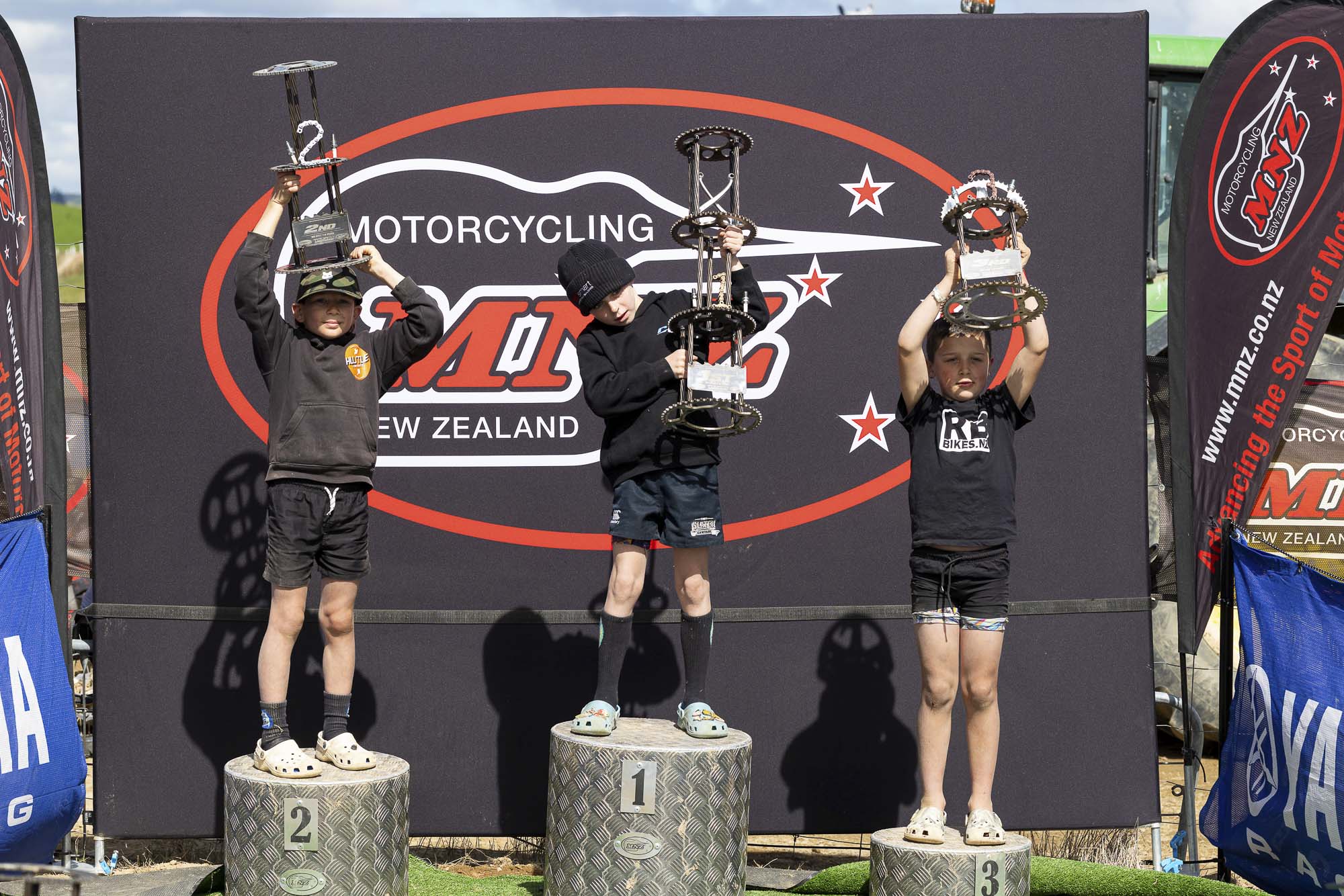The MX65 7-8 Years class podium (from left): Finnian Gillies (2nd), Jackson Slater (1st) and Knox Gibson (3rd) at the 2026 NZ Mini Motocross Nationals