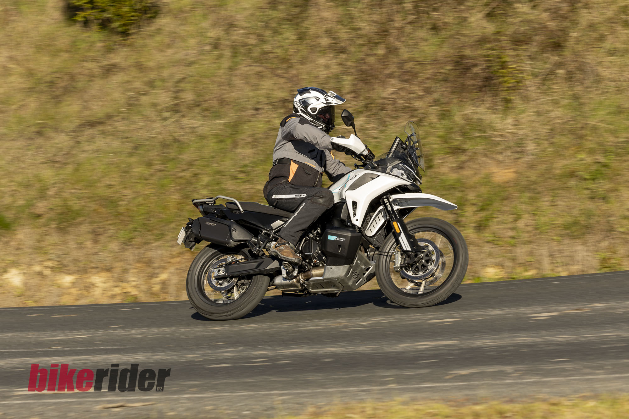 CFMOTO 1000MT-X adventure bike ridden on a sealed back road