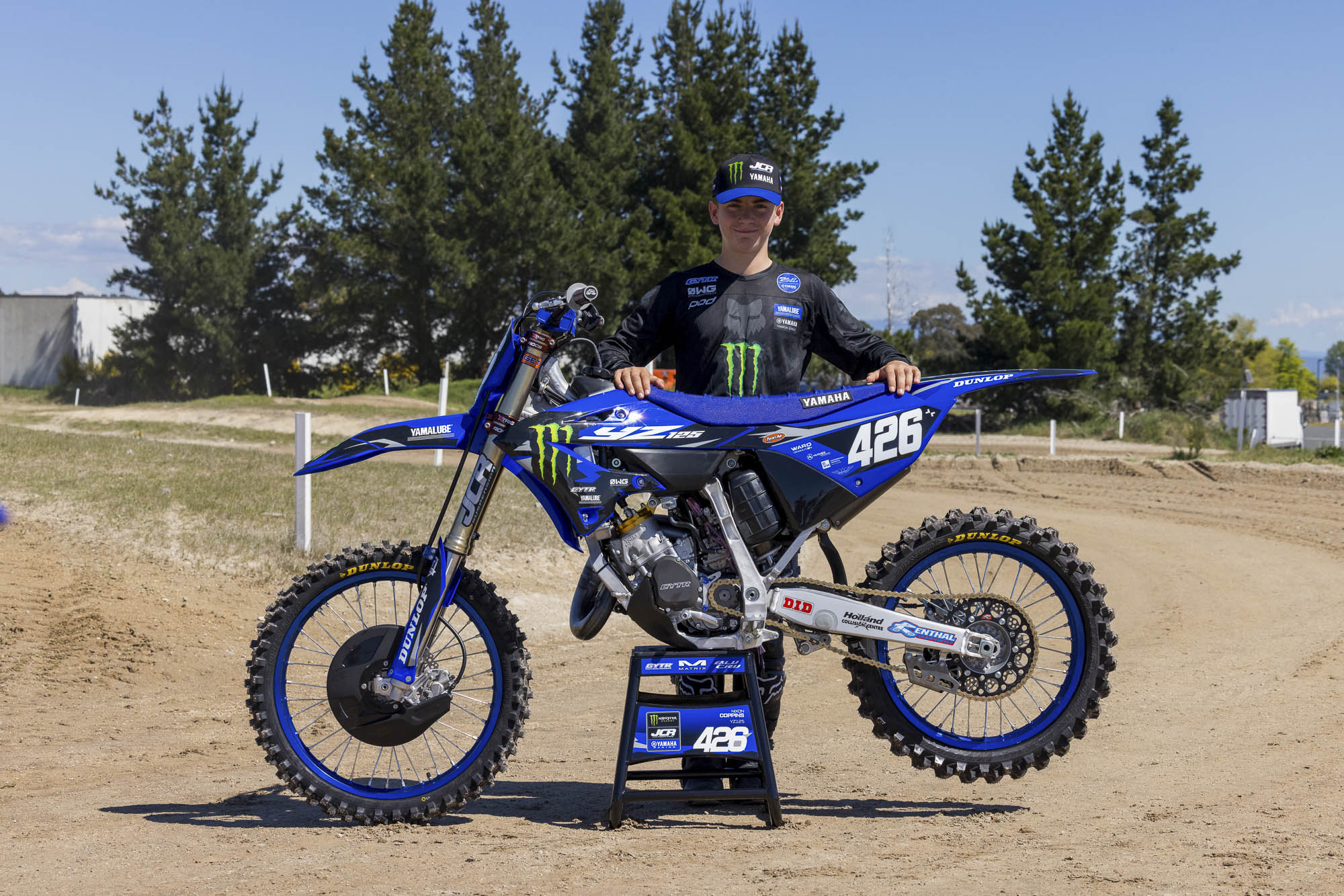 Nixon Coppins standing behind his number 426 Yamaha YZ125 at Taupō MX Fest