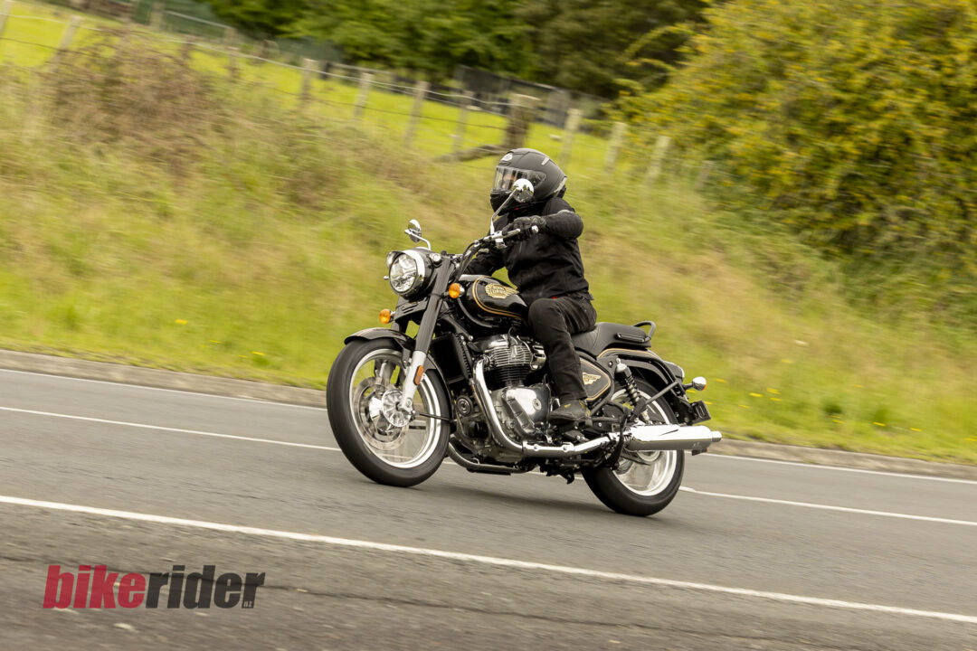 Royal Enfield Bullet 650 in Cannon Black: rider approaching a country-road bend