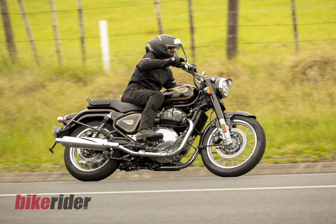 Royal Enfield Bullet 650 in Cannon Black: rider right-side road action