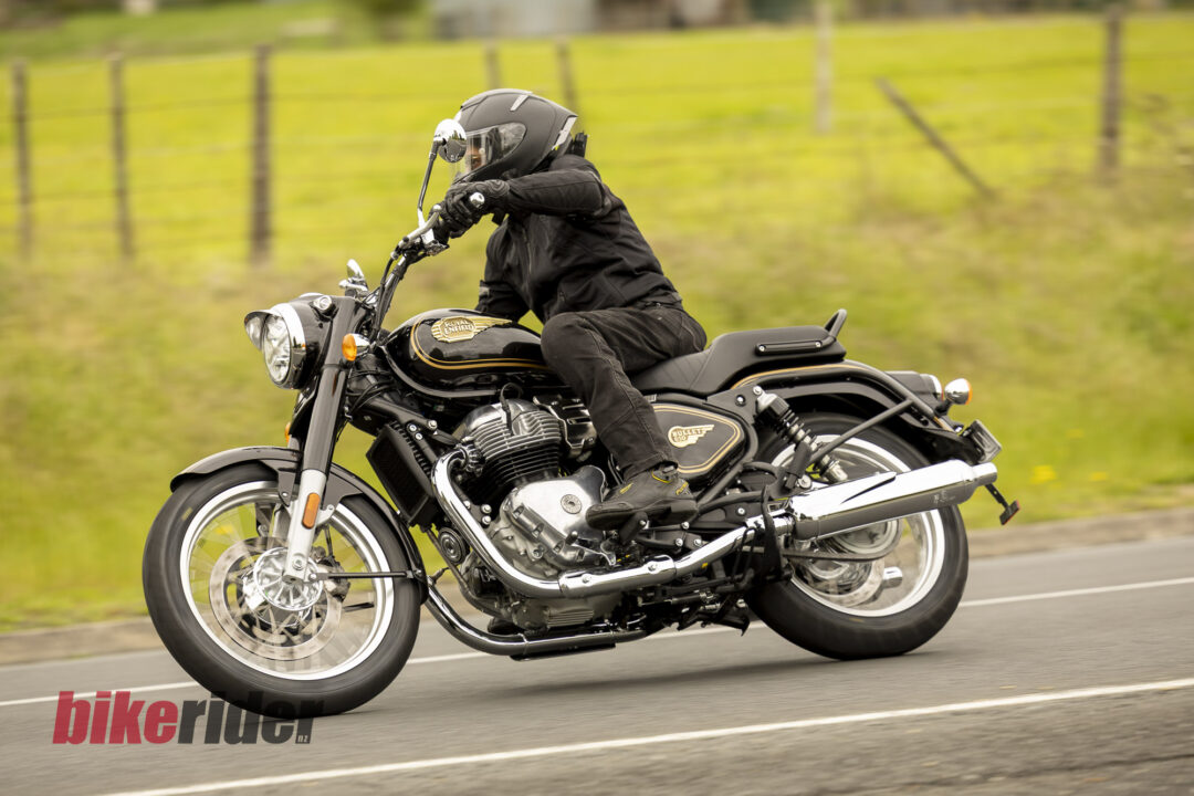 Royal Enfield Bullet 650 in Cannon Black: rider left-side road action