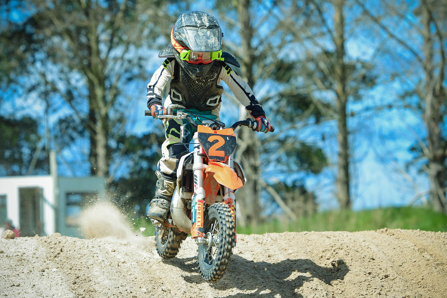 Corbin Wind riding his number 2 motocross bike on a dirt track.