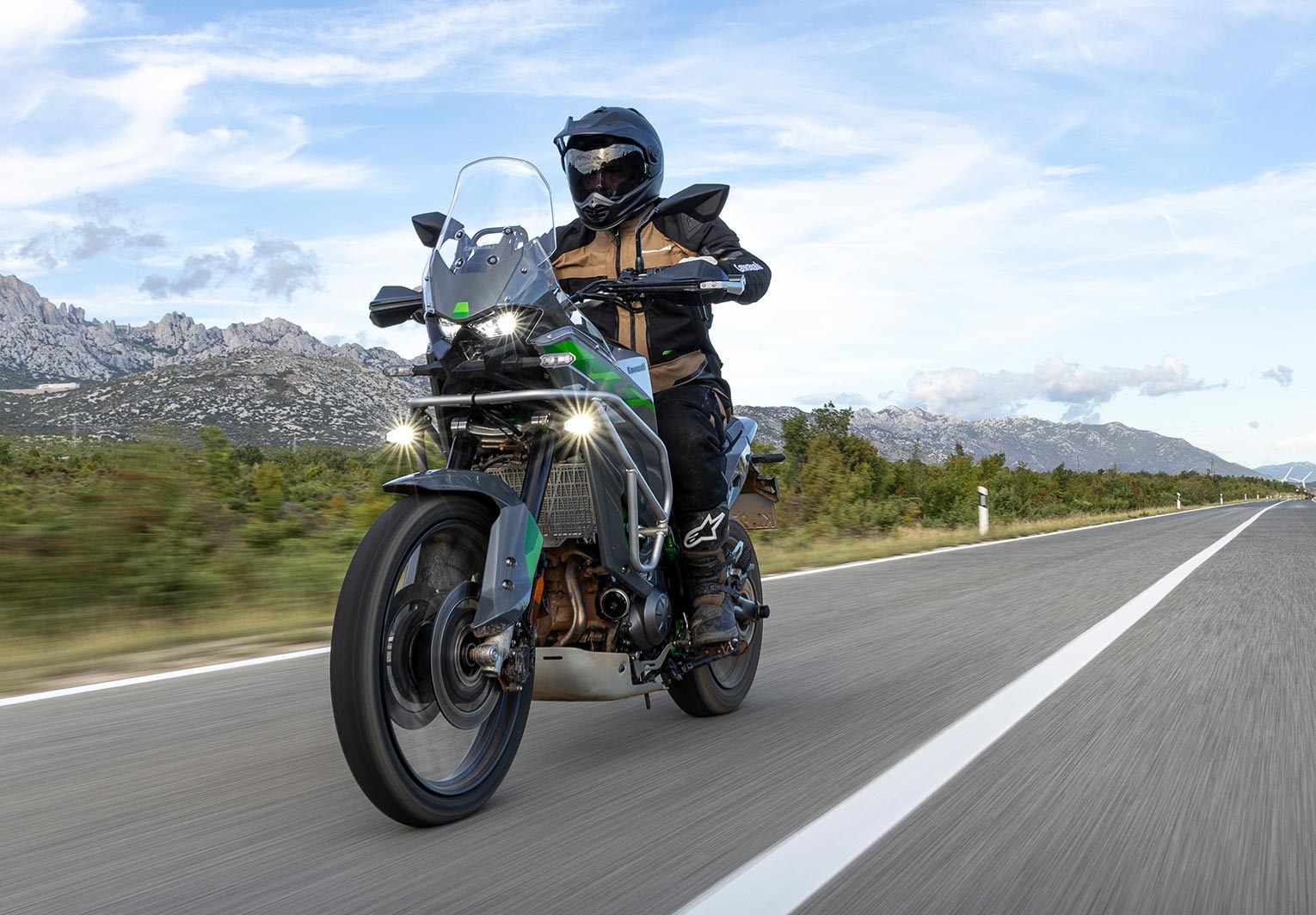 Kawasaki KLE650 riding past wind turbines