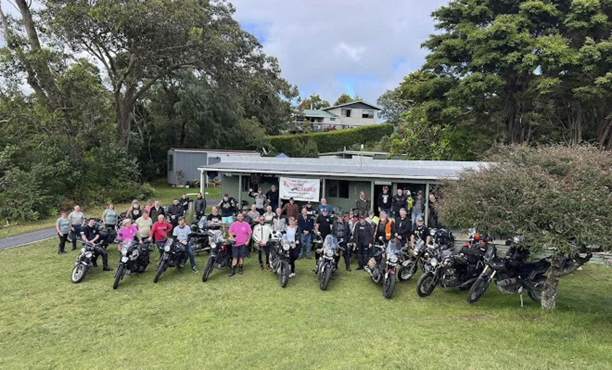 NZREOR rally participants gathered with their Royal Enfield motorcycles
